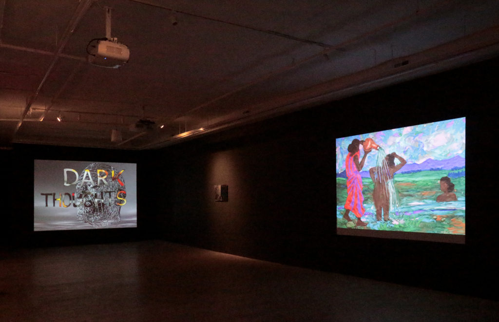 Installation view of Ezra Wube's exhibition Darkness, projections on walls