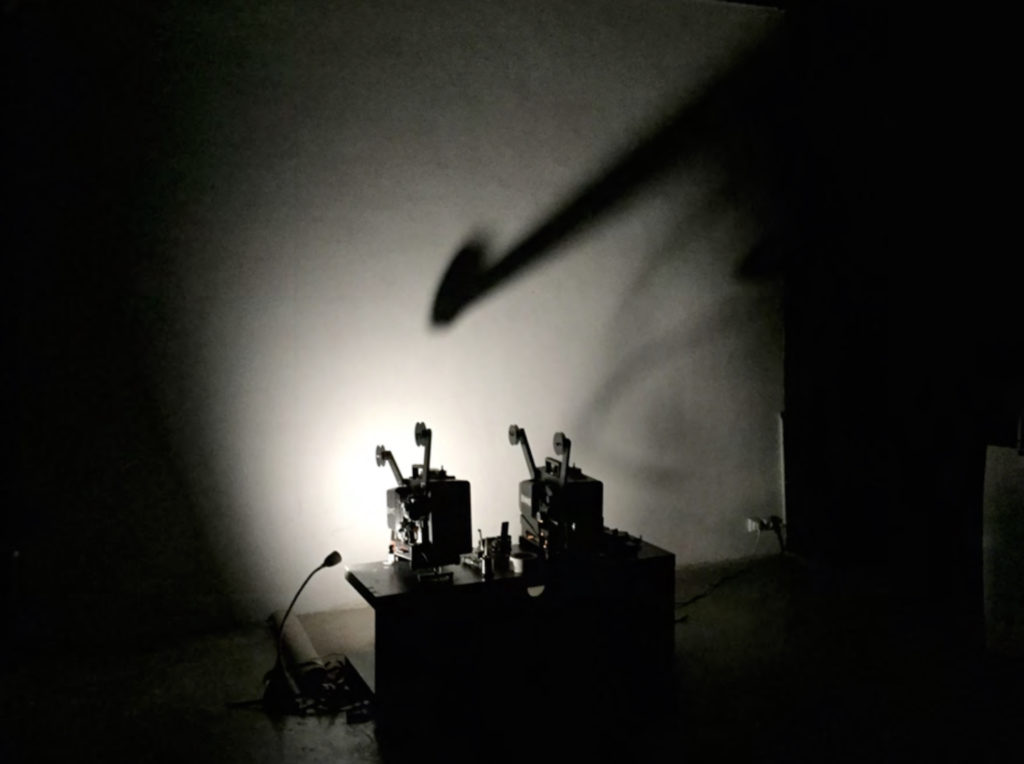 From Luis Macias' performance, two 16mm film projectors